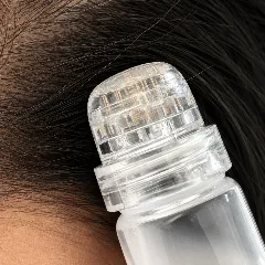 Close up of the microneedle head under its clear dome